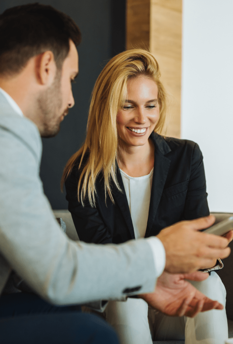 Woman and man looking at tablet together