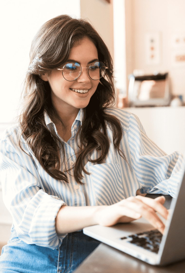 Happy woman working on a laptop